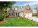 Lovely brick home features a two-car garage, lush lawn, and inviting facade, blending comfort and sophistication at 2478 23Rd Ne St, Hickory, NC 28601