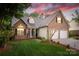 Charming brick home featuring a two-car garage, manicured lawn, and inviting entrance, perfect for suburban living at 2478 23Rd Ne St, Hickory, NC 28601