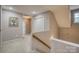 Second floor hallway with carpet floors and stairway with wooden handrail at 2478 23Rd Ne St, Hickory, NC 28601