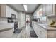 Bright kitchen with white cabinets, stainless steel appliances, and tiled floors at 2478 23Rd Ne St, Hickory, NC 28601