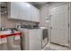 Laundry room with appliances, cabinets, utility sink and a door at 2478 23Rd Ne St, Hickory, NC 28601