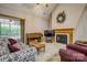 Inviting living room with fireplace, piano, and large windows at 2478 23Rd Ne St, Hickory, NC 28601