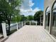 Outdoor back deck featuring white rails and black wrought iron spindles with water and lush green views at 255 Charlotte Ann Ln, Hickory, NC 28601