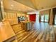 Large kitchen featuring custom cabinetry, island with cooktop, and view to living room and outdoor deck at 255 Charlotte Ann Ln, Hickory, NC 28601