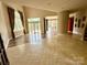 Bright living room featuring tile and wood floors, high ceilings, large windows and beautiful outdoor views at 255 Charlotte Ann Ln, Hickory, NC 28601