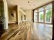 Large living room boasts sleek wood floors, large arched windows, high ceilings, and access to deck at 255 Charlotte Ann Ln, Hickory, NC 28601