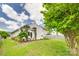 Beautiful backyard with lush green grass, pergola, and landscaped garden beds at 2810 Berry Creek Rd, Charlotte, NC 28214