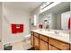 Well-lit bathroom with double sinks, ample counter space, and modern fixtures at 2810 Berry Creek Rd, Charlotte, NC 28214