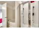 Bright bathroom featuring a shower with glass doors and a soaking tub at 2810 Berry Creek Rd, Charlotte, NC 28214