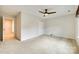 Spacious bedroom with carpet, ceiling fan, window, and closet at 2810 Berry Creek Rd, Charlotte, NC 28214