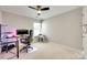 Bedroom featuring a ceiling fan, large desk, and ample space at 2810 Berry Creek Rd, Charlotte, NC 28214