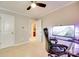 Comfortable bedroom with a ceiling fan and a modern desk setup at 2810 Berry Creek Rd, Charlotte, NC 28214