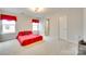 Spacious bedroom with plush carpeting, natural light, and convenient closet space at 2810 Berry Creek Rd, Charlotte, NC 28214
