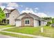 Charming single-Gathering home featuring stone accents, a well-manicured lawn, and an attached one-car garage at 2810 Berry Creek Rd, Charlotte, NC 28214