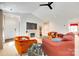 Bright living room with a fireplace, cozy seating, and plenty of natural light at 2810 Berry Creek Rd, Charlotte, NC 28214