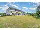 Expansive backyard with lush lawn and patio area, perfect for outdoor entertaining and relaxation at 3925 Tokay Ln, Fort Mill, SC 29707