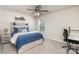 Comfortable bedroom with a blue bed, ceiling fan, and a window view, perfect for relaxation and rest at 3925 Tokay Ln, Fort Mill, SC 29707