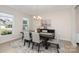 Elegant dining room with modern chandelier, stylish rug, and contemporary furniture at 3925 Tokay Ln, Fort Mill, SC 29707