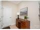 Welcoming entryway with wood floors, decorative console, and a stylish lamp, setting a warm tone at 3925 Tokay Ln, Fort Mill, SC 29707