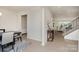 Spacious hallway with hardwood floors connecting the dining room and living room with elegant stairway at 3925 Tokay Ln, Fort Mill, SC 29707