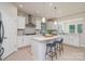 Modern kitchen with white cabinets, stainless steel appliances, and a center island with bar stools at 3925 Tokay Ln, Fort Mill, SC 29707