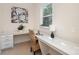 Well-lit office space featuring a built-in desk, ample storage, and large window providing natural light at 3925 Tokay Ln, Fort Mill, SC 29707