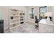 Bright office space with built-in bookshelves, a desk, and lots of natural light at 3925 Tokay Ln, Fort Mill, SC 29707