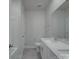 Bathroom with a white vanity, a shower-tub combo, and neutral tiles at 4142 Longmore Ln, Kannapolis, NC 28081