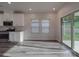 Bright breakfast area with stainless steel appliances, white cabinets, natural light and a sliding glass door at 4142 Longmore Ln, Kannapolis, NC 28081