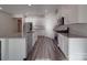 Modern kitchen with white cabinets, stainless steel appliances, grey granite countertops, and wood-look floors at 4142 Longmore Ln, Kannapolis, NC 28081