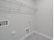 Laundry room features tile floors and wire shelving for storage at 4142 Longmore Ln, Kannapolis, NC 28081