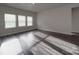 Bright living room featuring three windows allowing for ample natural light and neutral-toned walls at 4142 Longmore Ln, Kannapolis, NC 28081