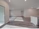 Open-concept living room features sliding glass doors, recessed lighting, and seamless transitions to the kitchen at 4142 Longmore Ln, Kannapolis, NC 28081