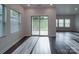 Bright and airy living room with sliding glass doors to the backyard and large windows at 4142 Longmore Ln, Kannapolis, NC 28081