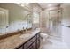Bathroom featuring a granite-topped vanity and walk-in shower at 4600 Spicewood Dr, Charlotte, NC 28227
