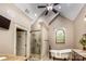 Primary bathroom featuring vaulted ceiling, soaking tub, and glass shower at 4600 Spicewood Dr, Charlotte, NC 28227