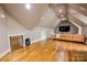 Bonus room featuring a built-in beverage cooler and hardwood floors at 4600 Spicewood Dr, Charlotte, NC 28227