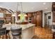 Kitchen with granite countertops, stainless steel appliances, and island with barstool seating at 4600 Spicewood Dr, Charlotte, NC 28227