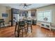 Eat-in kitchen featuring dark wood cabinetry, stainless appliances, and hardwood flooring at 4600 Spicewood Dr, Charlotte, NC 28227