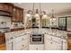 Kitchen featuring stainless steel appliances, an island, and a view of the backyard through the windows at 4600 Spicewood Dr, Charlotte, NC 28227