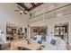 Open-concept living area with hardwood floors, coffered ceilings, and views of the kitchen and dining areas at 4600 Spicewood Dr, Charlotte, NC 28227