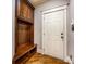 Mudroom area with a bench, hooks for storage, and a door to the exterior at 4600 Spicewood Dr, Charlotte, NC 28227