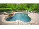 Inviting pool area with waterfall feature, stone patio, and lounge chairs for relaxation at 4600 Spicewood Dr, Charlotte, NC 28227