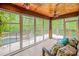 Bright and airy sunroom with large windows offering views of the pool and backyard at 4600 Spicewood Dr, Charlotte, NC 28227