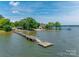 Aerial view of lakeside home with private dock and waterfront access at 5200 Masons Ferry Rd, Clover, SC 29710