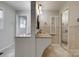 Bathroom featuring double sinks, custom vanity, stylish mirror, and updated tile work at 5200 Masons Ferry Rd, Clover, SC 29710