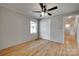 Bedroom with a ceiling fan, hardwood floors, closet, and natural light at 5200 Masons Ferry Rd, Clover, SC 29710