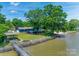 Picturesque waterfront property with a charming gazebo, private dock, and lush greenery, offering serene views at 5200 Masons Ferry Rd, Clover, SC 29710