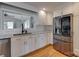 Bright kitchen features stainless steel refrigerator, undermount sink, white cabinets, and granite countertops at 5200 Masons Ferry Rd, Clover, SC 29710