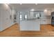 Modern kitchen with white cabinetry, granite countertops, stainless steel appliances, and an island with seating at 5200 Masons Ferry Rd, Clover, SC 29710
